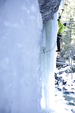 Iceclimber climbing on an ice face, Immenstadt, Bavaria, Germany