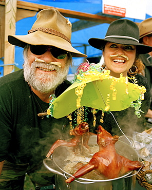 Vendors and boiled possums at the Possum Pies & Pate stand, Hokitika Wildfoods festival, Hokitika, west coast, South Island, New Zealand