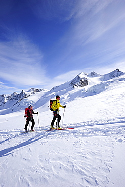 Two backcountry skiers ascending to Wildspitze, Oetztal Alps, Tyrol, Austria