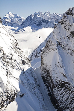 Helicopter flight over snowy mountains, Southern Alps, South Island, New Zealand