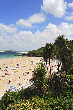 People sunbathing at Porthminster Beach, St. Ives, Cornwall, England, United Kingdom