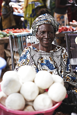 Woman offering soap at a market, Yanfolila, Sikasso Region, Mali