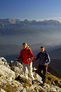 Couple on a hiking tour at heimgarten, Upper Bavaria, Bavaria, Germany