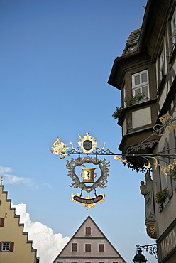 Pharmacy sign and houses in the old town of Rothenburg ob der Tauber, Romantic Road, Franconia, Bavaria, Germany