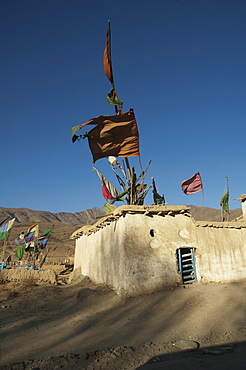 Flags fluttering in the wind over the Shrine of Khoja Mohammad Baba near Jalrez, Vardak Province, Afghanistan