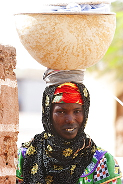 Woman carrying a calabash on her head, Bamako-Djenne Road, Mali