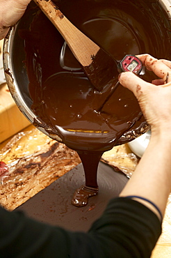 Chocolate being poured from Mixing Bowl with Thermometer, Montreal, Quebec