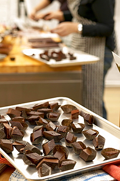 Chocolates on Baking Tray, People Baking in Background, Montreal, Quebec