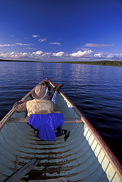 Man Relaxing in Canoe, Sutton Lake, Northern Ontario