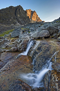 Flowing glacial creek with Mount Sir James MacBrien in background, Cirque of Unclimbables, Nahanni National Park, Northwest Territories