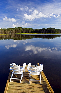 Adirondack chairs on dock, Two Mile Lake, Duck Mountain Provincial Park, Manitoba