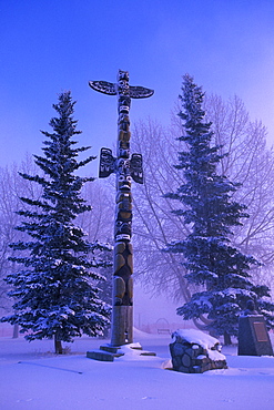 Totem Pole in Winter with Pine Trees, Whitehorse, Yukon