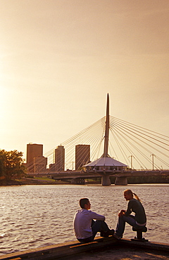 Teens Relaxing on a Dock with Red River in the background, Winnipeg, Manitoba