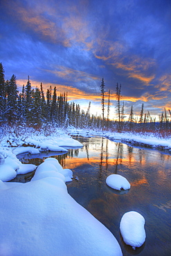 Orange clouds at sunset and Little Hazel Creek, Yukon