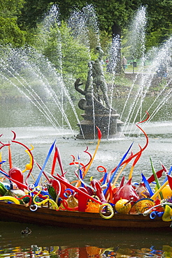 Thames Skiff by Dale Chihuly in front of the Palm House Royal Botanic Gardens, Kew, Surrey, England, United Kingdom