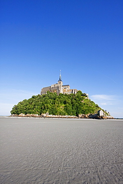 Mont-Saint-Michel and mudflats in the bay, as seen from the West, France