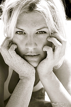 Hawaii, Big Island, Beautiful blond woman covered in sand, Black and white.