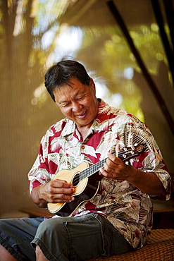 Hawaii, Maui, Local male playing an ukulele.