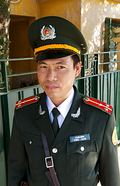 South East Asia, Vietnam, Hanoi, A policeman poses for his portrait.