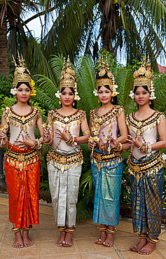 Cambodia, Siem Reap, Four young dancers wearing traditional costumes, posing.