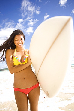 Hawaii, Oahu, Surfer girl enjoying a day out.