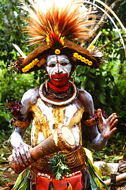 Papua New Guinea, Head shot of young man, face with war paint and wild hair