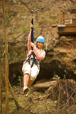 Hawaii, Maui, Zipline Adventure, Woman riding the zipline.