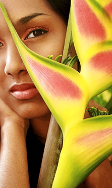 Hawaii, Oahu, Headshot portrait of Beautiful Gorgeous Young Girl with Heliconia ginger flower.