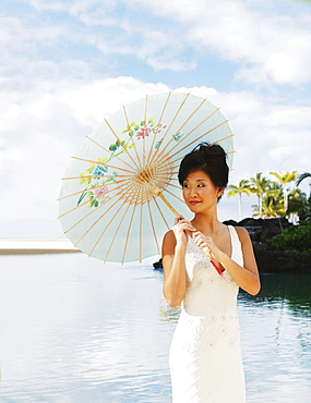 Hawaii, Oahu, Attractive young asian woman on the beach.