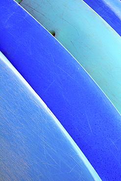 Hawaii, Oahu, Pattern shot of blue Kayaks stacked on each other.