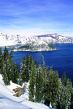 Oregon, Crater Lake National Park, Snowy Crater Lake and Wizard Island.