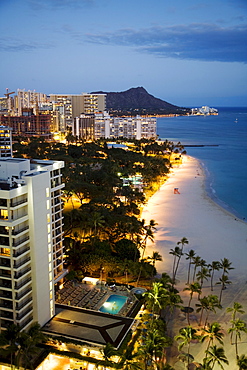 Hawaii, Oahu, Waikiki Beach and Diamond Head in the evening.