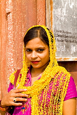 India, Old Delhi, Woman in colorful costume sari.