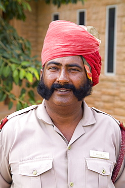 India, Rajasthan, Jodhpur, Umaid Bhawan Palace, Guard at entrance.