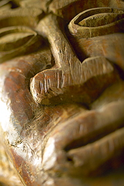 French Polynesia, Tahiti, Bora Bora, Close-up of the carved face of a wooden statue