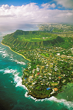 Hawaii, Oahu, Coastline aerial of Kahala homes and Diamond Head Crater, Waikiki hotels background