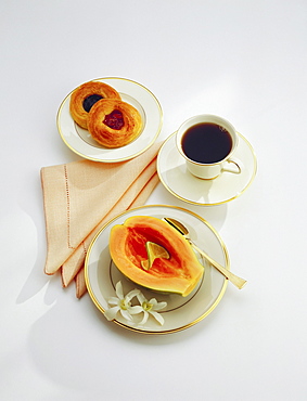 Continental breakfast, papaya, coffee, rolls