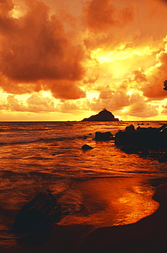 Hawaii, Maui, Hana, Gorgeous orange and yellow sunrise over the ocean