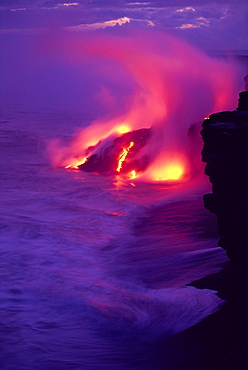 Hawaii, Big Island, Volcano lava meets the sea, steam rising, twilight 