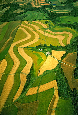 Agriculture - Aerial view of a farmstead and contour strip agricultural fields / Carol County, Maryland, USA.