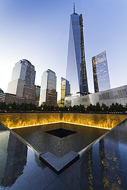 The National September 11 Memorial and One World Trade Center at night, New York City, New York, United States