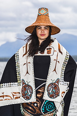 Tlingit first nation woman in traditional wardrobe on the shores of Teslin Lake, Teslin, Yukon, Canada