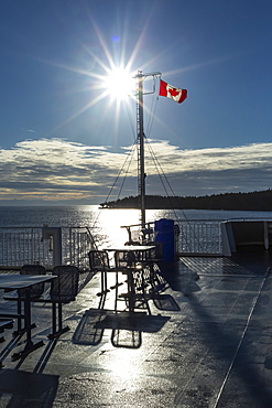 Deck of the new BC Ferry with a Canadian Flag, going to Mayne Island, British Columbia, Canada