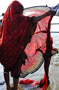 Women washing sari in the river, Tamil Nadu, India, Asia 