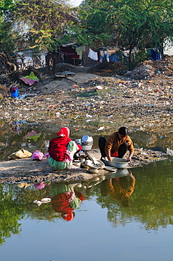 Washing vessels in the backyard of the house, Gujarat, India, Asia