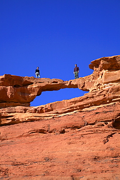 Tourists climbing at Wadi Rum, Jordan, Middle East