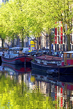 Houseboats on canal, Amsterdam, Netherlands, Europe