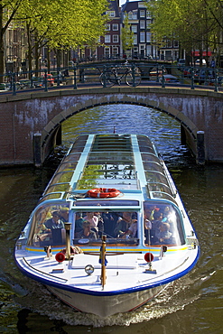 Tourist boat on Keizersgracht, Amsterdam, Netherlands, Europe