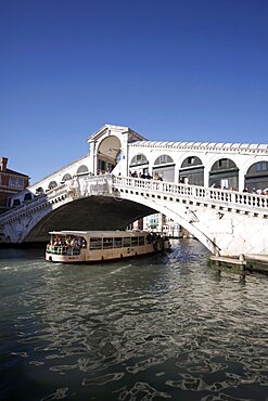 Public ferry and the Rialto Bridge over the Grand Canal, Venice, UNESCO World Heritage Site, Veneto, Italy, Europe