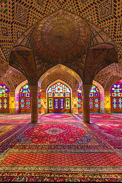 Nasir-ol-Molk Mosque (Pink Mosque), light patterns from colored stained glass illuminating the iwan, Shiraz, Fars Province, Iran, Middle East